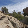 A hiker explores the rocks just east of the Warner Springs section of the PCT.