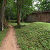 The Preah Khan Trail winds through low grass covered mounds as it loops.