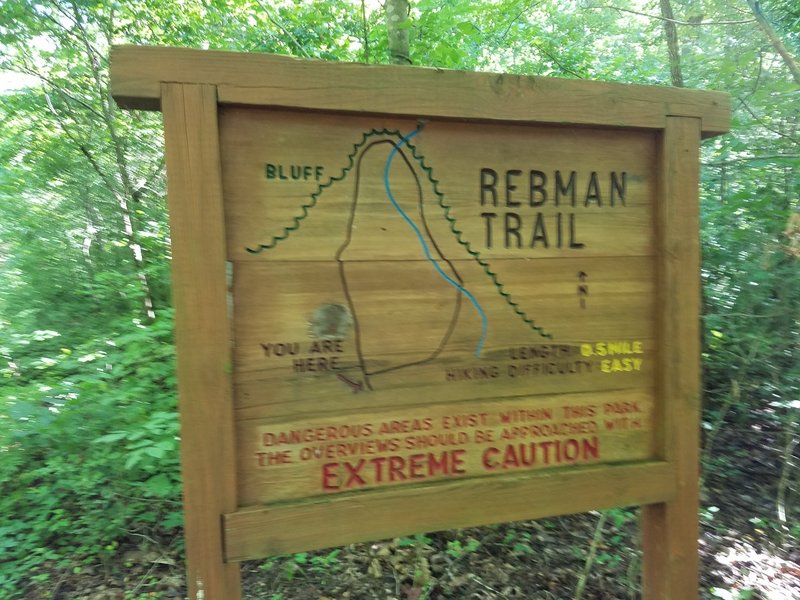 Rebman Trailhead is marked by a big wooden sign.