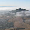 Cerro San Luis peeks through the clouds from Bishop Peak.