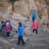 A French family hikes down the South Kaibab Trail near Ooh Aah Point.