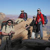 Four hikers take a break at Ooh Aah Point on the South Kaibab Trail.