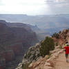 Two young hikers take in the majesty of the Grand Canyon from the South Kaibab Trail.