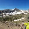 This panorama looks down to the valley/trailhead, and up toward Arapahoe Pass.