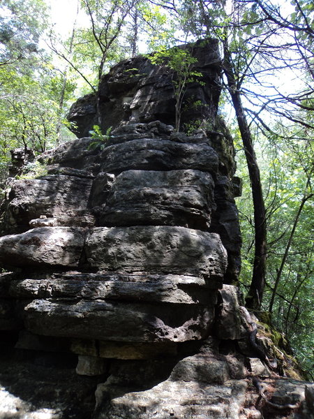 An impressive rock pillar stands along the loop.