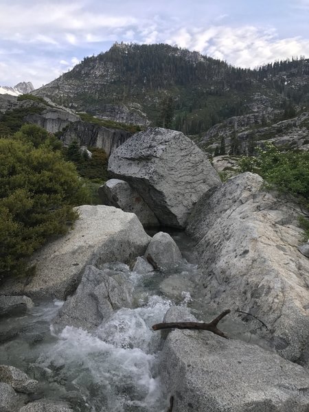 Crossing Upper Canyon Creek Lake outlet in Trinity Alps Wilderness