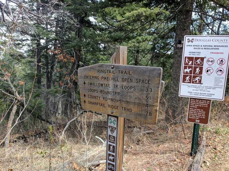 A sign marking the boundary between the National Forest and the the Pike Hill Open Space.