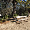 The Mule Trailhead features a map and a bench to rest on.