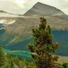 Titkana Peak with beautiful, bluegreen Adolphus Lake far below, looking east-southeast from high on Mumm Basin Route