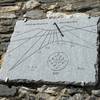 Sun dial at Rifugio Gardetta. In Occitan language, it reads "Time goes by. Pass it well."