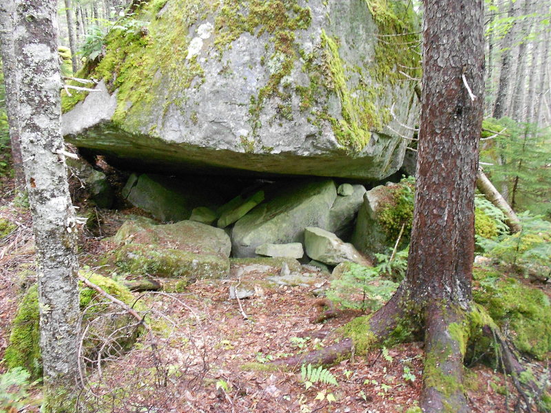 Natural rock outcropping along the trail serves as a temporary shelter.