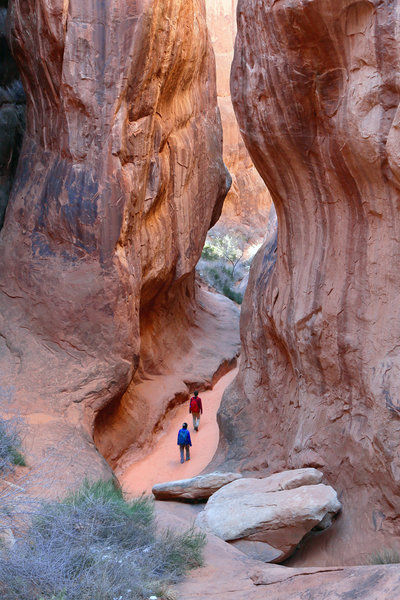 Exploring a side canyon in Fiery Furnace. Late December is a great time to visit. Fewer visitors so it is easier to get a permit for Fiery Furnace, and the low sun makes for beautiful light in the canyons.