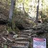 Some of the rocks stair found along the trail and a sign of the risk by the Upper Wildcat Falls.