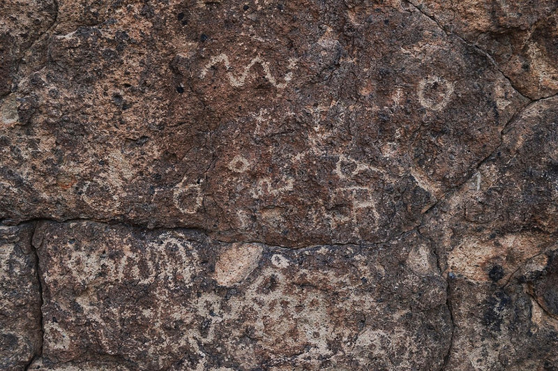 Faint petroglyphs visible along the Rings Loop Trail