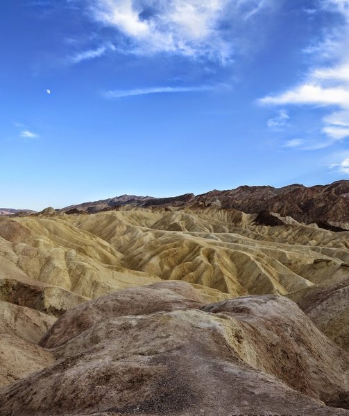 Zabriskie Point in Death Valley National Park with a daylight moon - life doesn't bet much better than this.