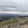 Summer storm off in the distance. View from the summit of Manns Peak