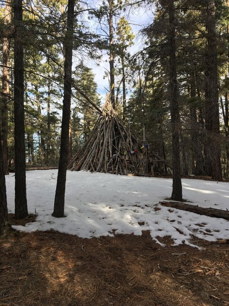 You're first "cool" site, a massive teepee draped with Nepalese prayer flags, take a look inside and trek forward!