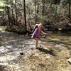 Girl Scout Troop 20793 crossing the stream on Longfield Branch Trail