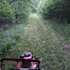 Volunteer working on mowing the trail. Just a little more to go.