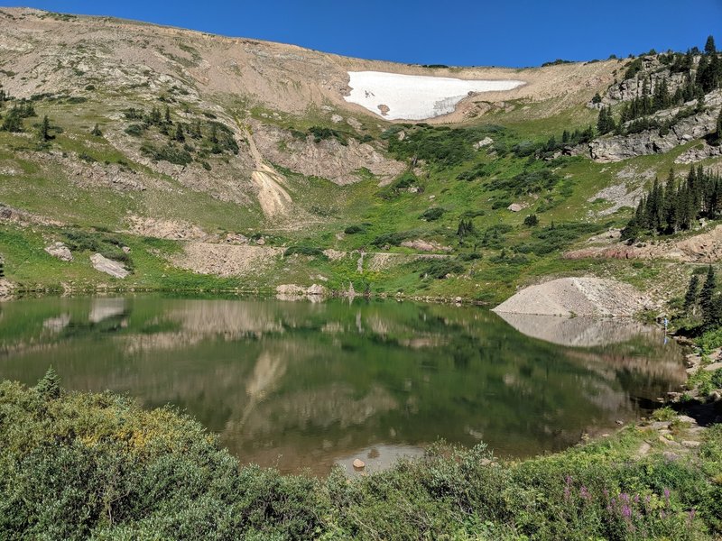 The road wraps around Yankee Doodle Lake