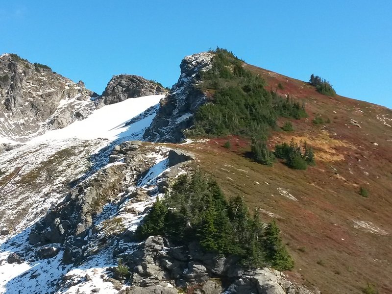 Summit ridge on right and hiker's summit in center.