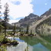 Andrews Peak reflects in Lake Nanita.