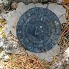 A Survey marker located on the peak.