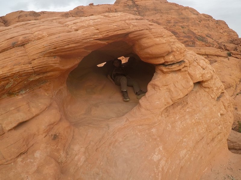 My little bro in a hole in the canyon wall.