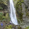 Cabin Creek Falls drops about 220 feet into a pool partially obscured by a fall block of basalt