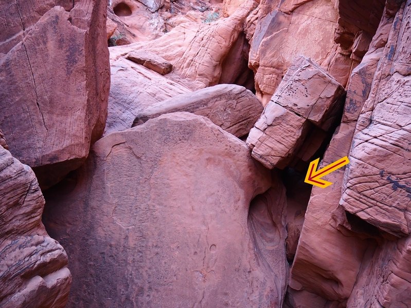 The steep 10-foot high slab can be by-passed via a hole (arrow)