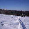 Donna, Betty Anne and Kevin on Snowshoe Trail A2 looking towards Aspen Lookout on E2 and the knoll that is scaled by Snowshoe Trails E3 and D6.