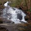 The water glistens in the sunlight as it cascades down Fall Branch Falls.