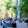 Crowd of tourists from view base of Multnomah Falls