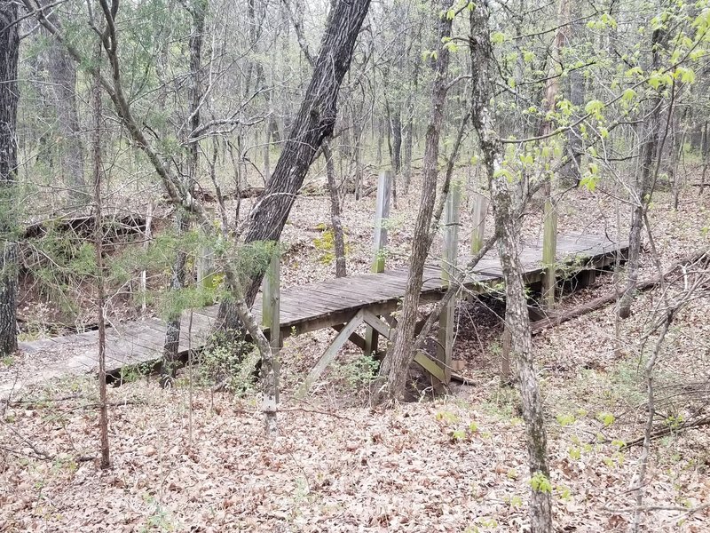 Wooden Footbridge over a seasonal stream bed near the southern end of the New Deal Trail, Lake Murray State Park, OK