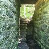 Near mile 18 there is a hidden support bridge. Here's a stone stairwell and corridor that runs beneath the trail.