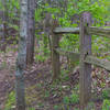 a fence along the highest elevation of the trail