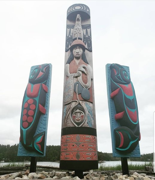 Coast Salish totem pole illustrating traditional reef net fishing, two Salmon storyboards and two cedar-strip canoes were dedicated by members of the Lummi Nation and the Saanich Nation at the August 25, 2016