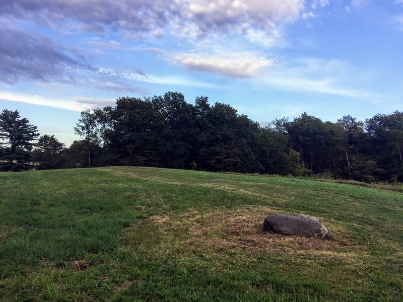 A mysterious boulder amidst the mowed Knox fields, near the entrance to the "secret" woods cut-through