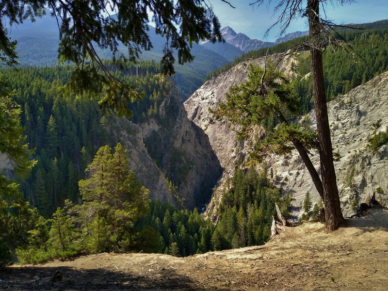 Canyon walls and mountains to the west, are seen from a Canyon Creek Trail lookout.
