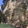 The massive bluff facing the trail. The castle remains are at the top of this bluff. Watch for rockfall if kayaking below, as pictured.