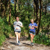 Runners on the unpaved section of the trail.