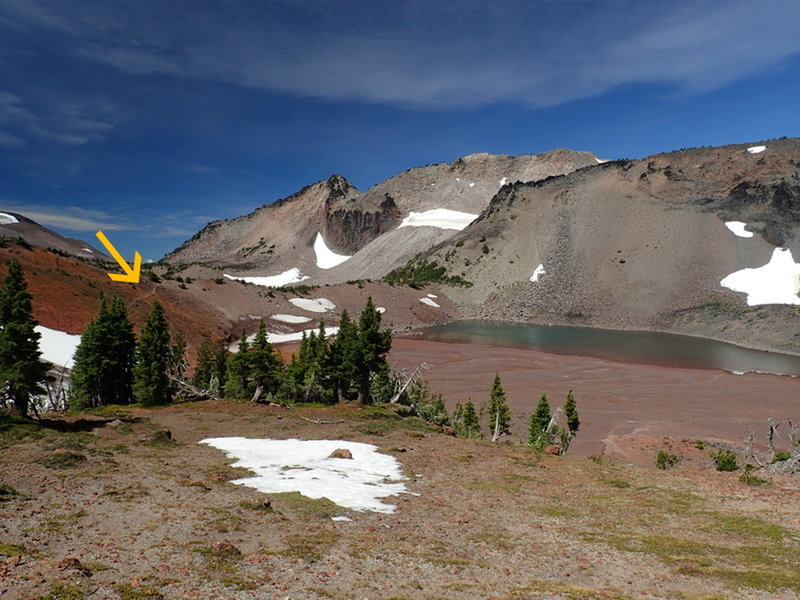The trail (arrow) continues past one of the Chambers Lakes