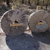 Retired millstones on the trail
