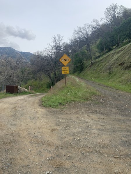 To the right is the start of the trail. Park here. Take the right fork at the gate.