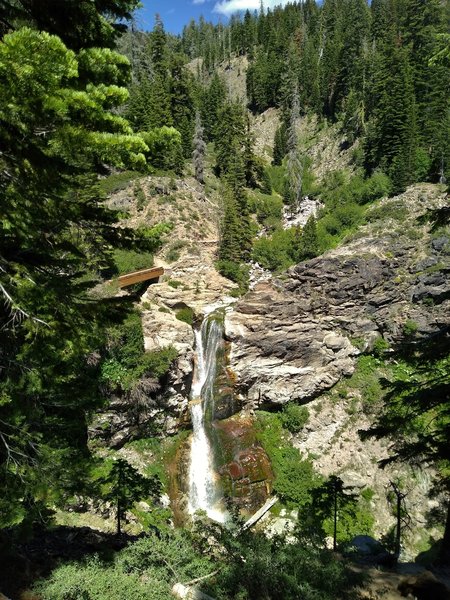 Mill Creek Falls plunges over 70 feet down in this rugged terrain.  At the top of the falls, East Sulphur Creek that is bridged on the left, collects Bumpass Creek (upper center right), and together they drop off the cliff as Mill Creek Falls.
