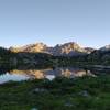 Mt. Lester's two peaks are reflected perfectly at sunrise, in the first Cook Lake.