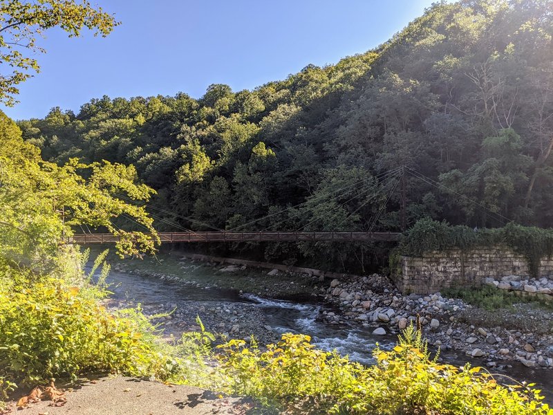 View of Grist Mill Trail and bridge from the south side of Patapsco River
