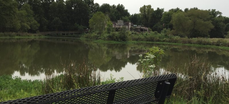 The Oxley Nature Center Interpretive Center across BJs Pond from the outlook on the Meadowlark Prairie Trail.
