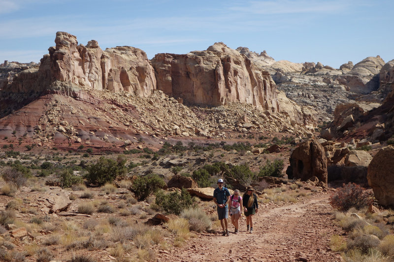 Three hikers traversing the section connecting Wild Horse Canyon to Bell Canyon