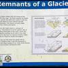 Interpretive sign describing views of glacier mounds in grass prarie.